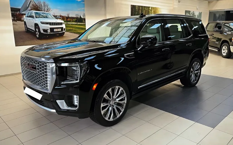 GMC Yukon Denali 2024 with driver